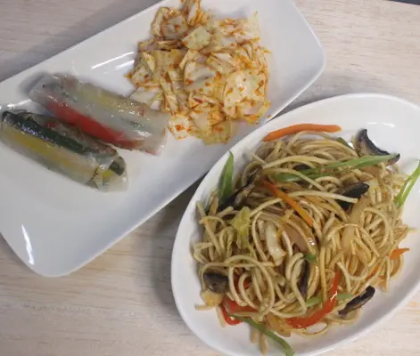 Hakka noddles with steamed rice paper spring rolls and kimchi 